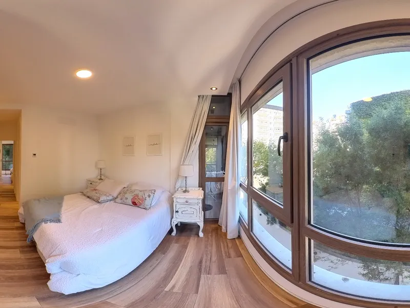 Departamento · dormitorio con ventanal en 360°